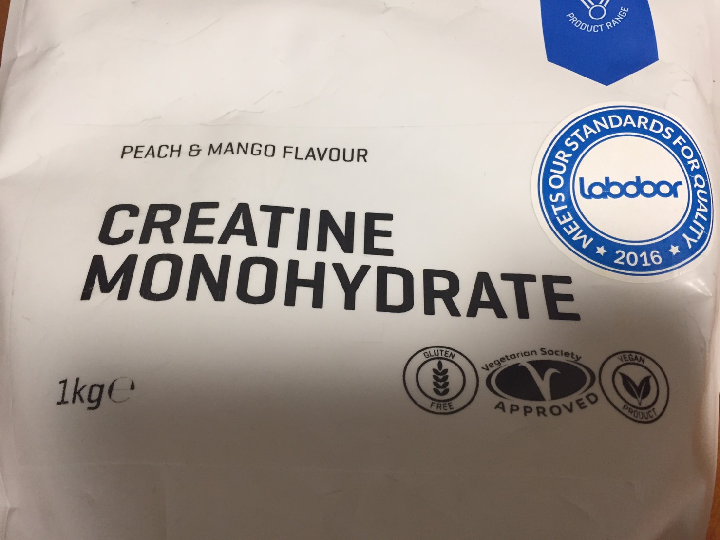 クレアチン一水和物粉末、ピーチマンゴー味のパッケージ